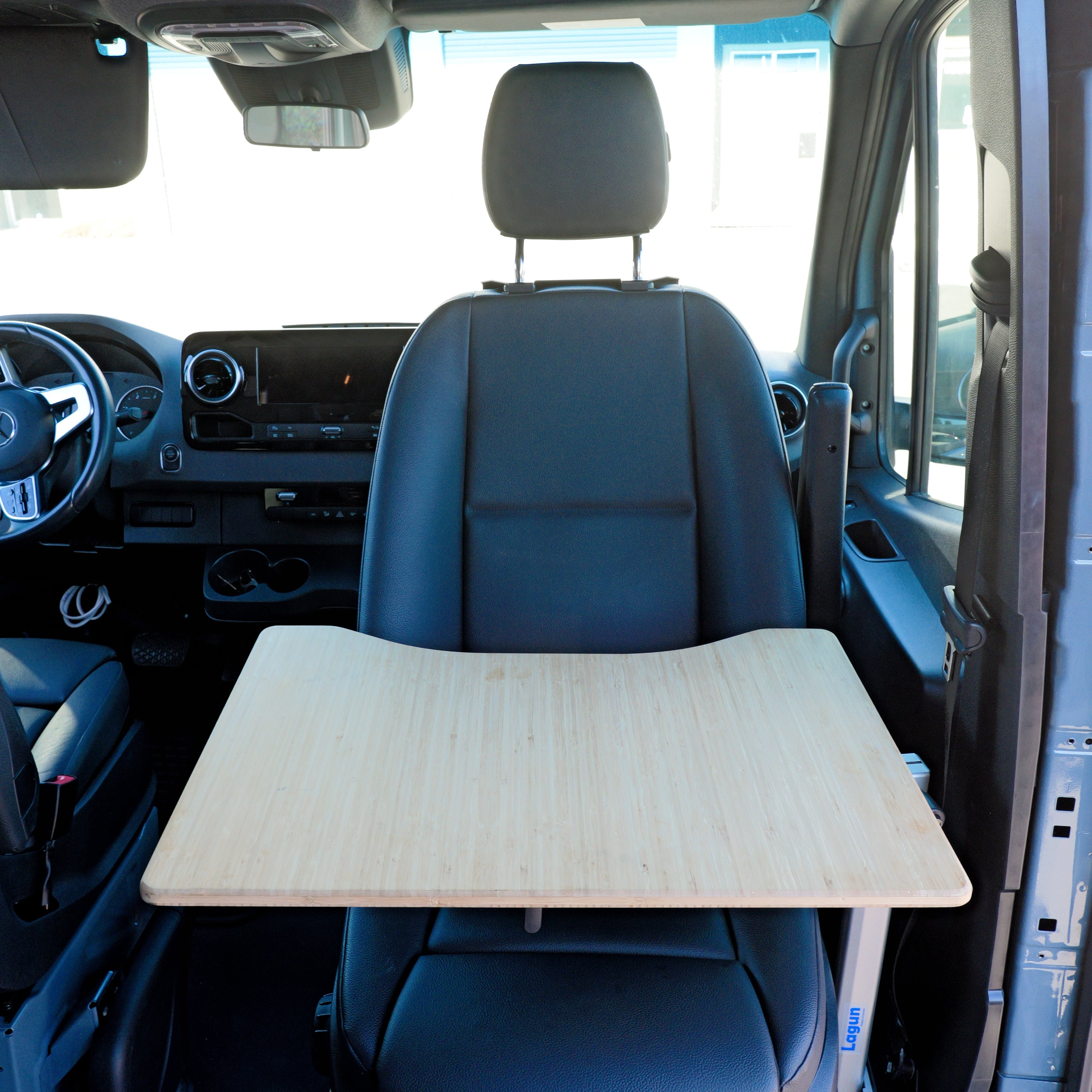 Wooden board on a car seat with a clear view of the car's interior.